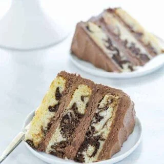 A slice of Gluten Free Marble Cake on a white plate
