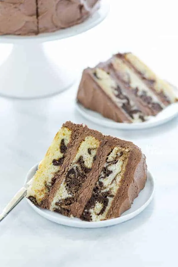 A slice of Gluten Free Marble Cake on a white plate