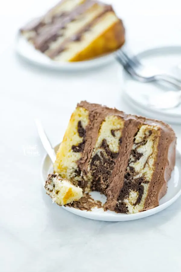 A delicious slide of gluten free marble cake with a fork.