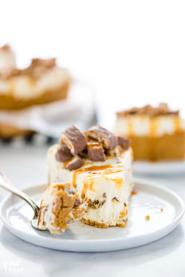 AD: This quick and easy Chocolix No Bake Cheesecake recipe features a smooth and creamy no bake cheesecake base on top of a classic graham cracker crust. The cheesecake filling is mixed with chopped Schar Chocolix and refrigerated until set. Before serving, top it with a drizzle of caramel and even more chopped Chocolix. This dessert is perfect any time of the year and is a simple and safe option to serve for anyone who has Celiac Disease or is gluten intolerant. #glutenfree #cheesecake #nobake