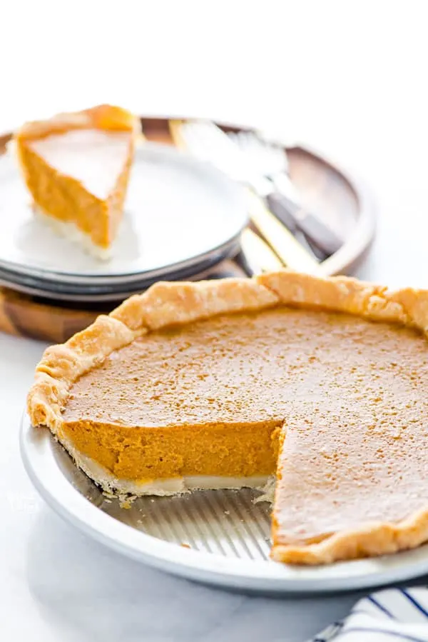 Easy Gluten Free Pumpkin Pie with a slice taken out of it.