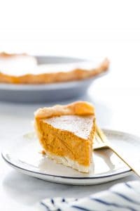 This is a classic, easy recipe for Gluten Free Pumpkin Pie. It’s made with a flaky pie crust, creamy pumpkin filling, and warm spices. This is THE pumpkin pie for your Gluten Free Thanksgiving! There’s a dairy free and lactose free option in the recipe notes with a Gluten Free Pie Crust recipe too. Gluten Free Pie Recipe from @whattheforkblog - visit whattheforkfoodblog.com for more gluten free desserts. #glutenfree #pumpkinpie #Thanksgiving #glutenfreedesserts #glutenfreepie