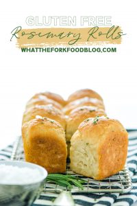 Gluten Free Rosemary Rolls are easy to make and are a great gluten free bread to add to your dinner rotation! They're based on my popular gluten free dinner roll recipe but they're flavored with fresh rosemary. These 1 hour dinner rolls pair great with Sunday dinners, weeknight meals, and any holiday meal! Gluten Free Rolls don't have to be intimidating - just follow this tried and true recipe! From @whattheforkblog visit whattheforkfoodblog.com for more gluten free baking recipes! #glutenfree