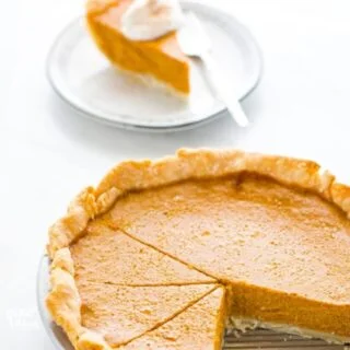 This is a classic, easy recipe for Gluten Free Pumpkin Pie. It’s made with a flaky pie crust, creamy pumpkin filling, and warm spices. This is THE pumpkin pie for your Gluten Free Thanksgiving! There’s a dairy free and lactose free option in the recipe notes with a Gluten Free Pie Crust recipe too. Gluten Free Pie Recipe from @whattheforkblog - visit whattheforkfoodblog.com for more gluten free desserts. #glutenfree #pumpkinpie #Thanksgiving #glutenfreedesserts #glutenfreepie