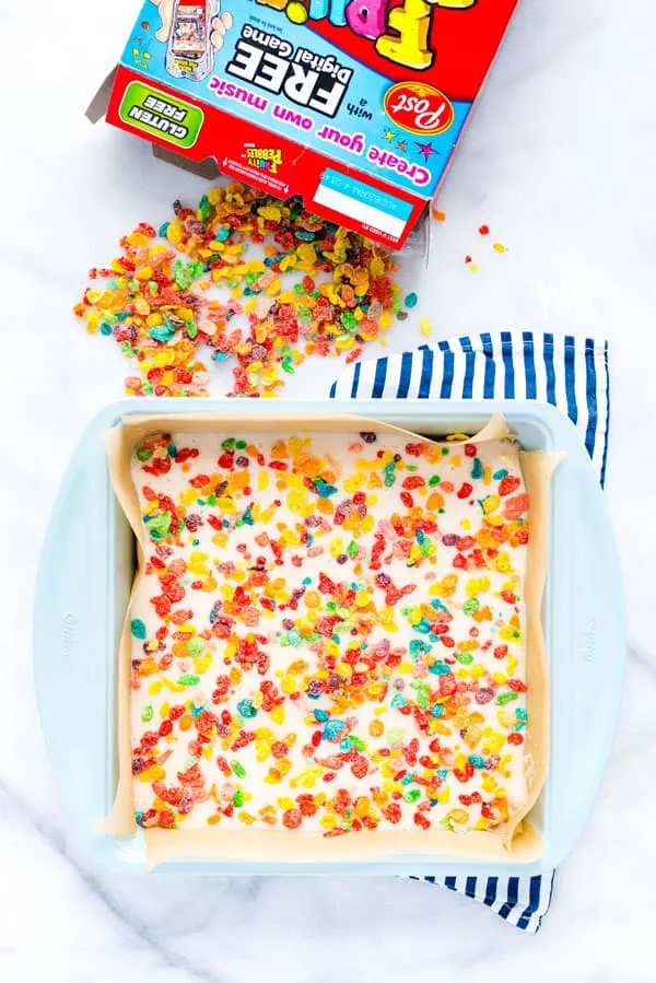 Gluten Free Fruity Pebbles Cake with Cereal Milk cake batter in a pan ready to be baked