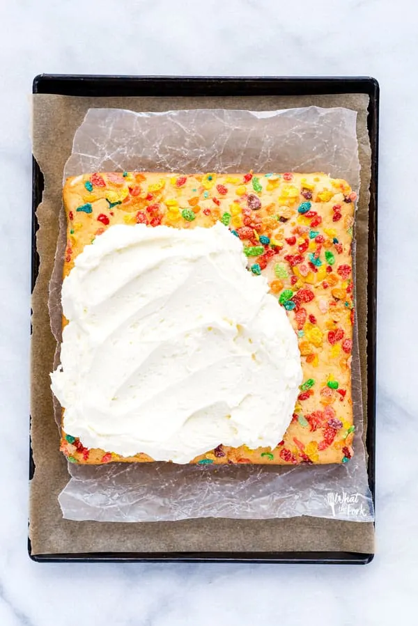 AD Finally, a gluten free cereal milk cake! This Gluten Free Fruity Pebbles Cake with Cereal Milk is a trendy cake that those on a gluten free diet can enjoy! It’s a fluffy gluten free white cake made with Fruity Pebbles cereal milk and topped with even more Fruity Pebbles cereal. Finish it off with the best, creamy vanilla buttercream frosting and even more Fruity Pebbles. It’s a gluten free dessert that anyone would enjoy, especially cereal lovers! #glutenfree #cerealmilk #cake #glutenfreecake