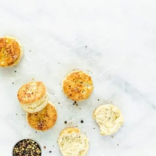 This is the best recipe for gluten free parmesan black pepper biscuits! These biscuits are light, fluffy, with amazing flavor and texture. They've got a nice crisp bottom and beautifully browned top. Kick that gluten free diet up a notch with this gluten free biscuit recipe! This post is full of gluten free baking tips plus a recommendation for the best gluten free flour blend for these biscuits. #glutenfree #biscuits #glutenfreebiscuits #glutenfreebaking #glutenfreerecipes