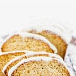 This simple and easy Gluten Free Eggnog Bread with Eggnog Icing is a wonderful holiday quick bread recipe. Baking with eggnog is one of the best ways to use leftover eggnog! The eggnog icing is spectacular but can be left off. This can also be baked as 4 mini loaves, the perfect size for gifting. Gluten Free Bread recipe from @whattheforkblog - visit whattheforkfoodblog.com for more! #glutenfree #glutenfreebread #eggnog #Christmas #holidaybaking #quickbread