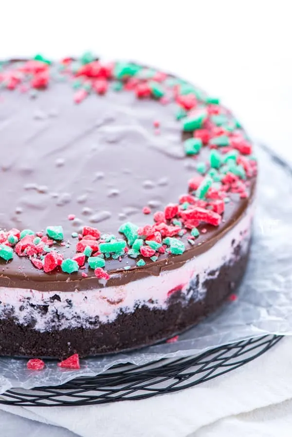 Gluten Free Peppermint Stick Ice Cream Pie on a serving platter with wax paper