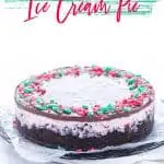 This Peppermint Ice Cream Pie is a family Christmas tradition! It’s our must-make Christmas dessert. This simple ice cream no-bake dessert recipe is so easy to make and it has to be made ahead of time so it’s perfect for holiday parties. Make it gluten free with with a gluten free chocolate cookie crust or use regular Oreos if you don’t need gluten free. Recipe from @whattheforkblog - visit whattheforkfoodblog.com for more! #Christmas #PeppermintStick #icecream #dessert #nobake #nobakerecipe