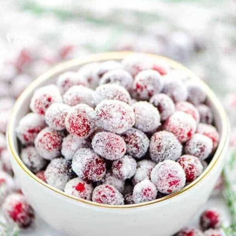 Sugared cranberries in a white bowl