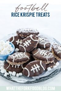 Chocolate Rice Krispies Treats are turned into Football Rice Krispie Treats for game day! They’re a chocolate treat base cut into football shapes then dipped in chocolate with white laces piped onto resemble footballs. This easy, no-bake dessert is perfect for tailgating, football parties, playoff games, and Superbowl parties. Game day desserts are the best part about game day foods so these are a must make dessert recipe! #gamedayfood #footballfood #ricekrispietreats #glutenfree #nobakedessert