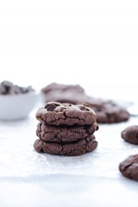 a stack of three gluten free double chocolate chip cookies