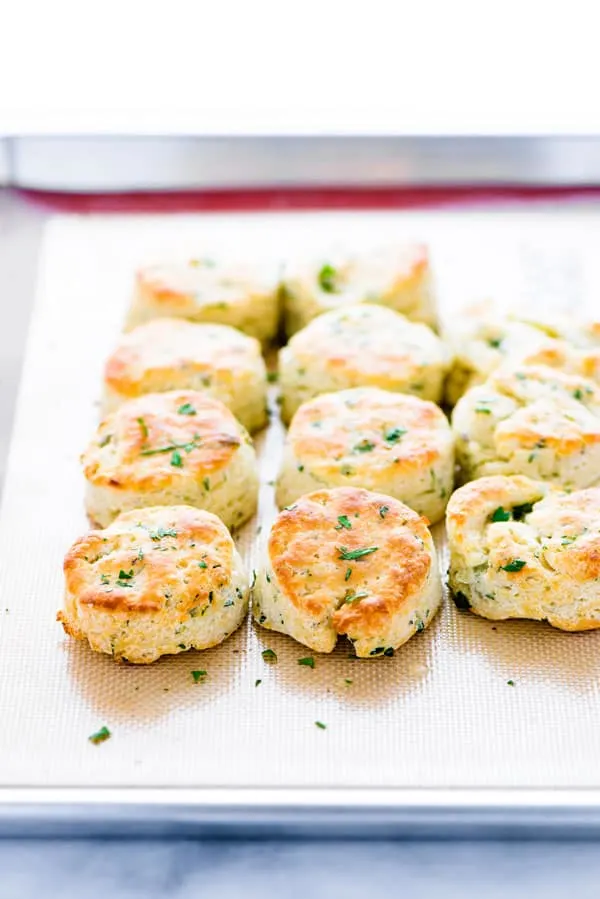 Finished gluten free biscuits recipe with garlic and herbs on a sheet pan