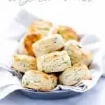 This is an easy Gluten Free Biscuits Recipe made with buttermilk and flavored with Garlic and Herbs. They’re light and fluffy with amazing flavor and texture. They've got a nice crisp bottom and beautifully browned top. If you've been missing good biscuits since starting a gluten free diet, try this simple recipe! Lots of gluten free baking tips plus a recommendation for the best gluten free flour for these biscuits. #glutenfree #biscuits #glutenfreebiscuits #glutenfreebaking #glutenfreerecipes