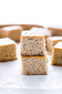 two slices of Gluten free banana bread bars stacked on wax paper