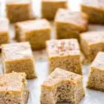 These gluten free banana bars are made from the best gluten free banana bread recipe! They’re super easy to make, bake faster than quick breads, and are great for breakfast meal prep. You can make them dairy free with your favorite plant based milk and you can add your favorite mix ins like walnuts, pecans, chocolate chips, or dried fruit. These are an easy, kid friendly breakfast too! Recipe from @whattheforkblog - visit whattheforkfoodblog.com for more gluten free breakfast recipes.