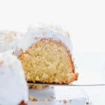 This is a simple, easy recipe for Coconut Pound Cake - aka Coconut Bundt Cake. It’s full of coconut flavor from coconut extract and shredded coconut and is topped with the most delicious, creamy coconut icing and garnished with toasted coconut. It’s a perfect dessert for a crowd or for holidays, birthday cake, and gatherings. It’s moist, dense, and has a tender crumb that’s addicting. Gluten Free Cake recipe from @whattheforkblog - visit whattheforkfoodblog.com for more gluten free desserts.