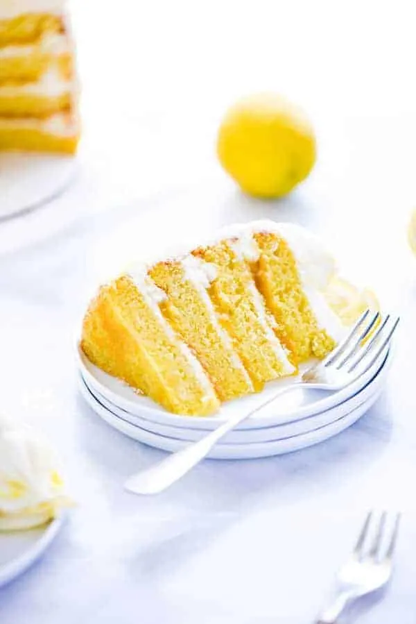 This simple Gluten Free Lemon Cake is one of THE BEST cakes I’ve ever had! Moist, tender cake layered with lemon curd and cream cheese frosting. It’s absolutely delicious and you’d never know it was gluten free! This recipe makes 2 6-inch cake layers that are sliced and turned into a 4 layer cake. You can double the recipe and bake it as a 9 inch cake or 8 inch cake. This lemon cake recipe is perfect for Easter, Mother’s Day, graduation parties, wedding showers, baby showers, and birthday cakes.