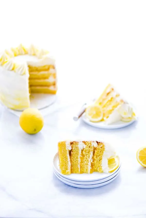 This simple Gluten Free Lemon Cake is one of THE BEST cakes I’ve ever had! Moist, tender cake layered with lemon curd and cream cheese frosting. It’s absolutely delicious and you’d never know it was gluten free! This recipe makes 2 6-inch cake layers that are sliced and turned into a 4 layer cake. You can double the recipe and bake it as a 9 inch cake or 8 inch cake. This lemon cake recipe is perfect for Easter, Mother’s Day, graduation parties, wedding showers, baby showers, and birthday cakes.