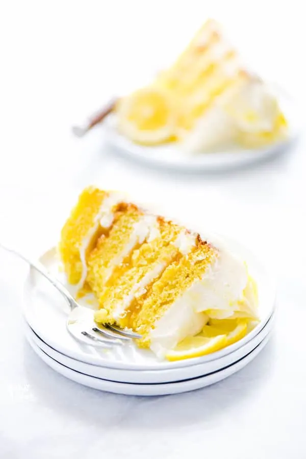 This simple Gluten Free Lemon Cake is one of THE BEST cakes I’ve ever had! Moist, tender cake layered with lemon curd and cream cheese frosting. It’s absolutely delicious and you’d never know it was gluten free! This recipe makes 2 6-inch cake layers that are sliced and turned into a 4 layer cake. You can double the recipe and bake it as a 9 inch cake or 8 inch cake. This lemon cake recipe is perfect for Easter, Mother’s Day, graduation parties, wedding showers, baby showers, and birthday cakes.