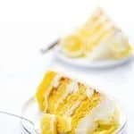 This simple Gluten Free Lemon Cake is one of THE BEST cakes I’ve ever had! Moist, tender cake layered with lemon curd and cream cheese frosting. It’s absolutely delicious and you’d never know it was gluten free! This recipe makes 2 6-inch cake layers that are sliced and turned into a 4 layer cake. You can double the recipe and bake it as a 9 inch cake or 8 inch cake. This lemon cake recipe is perfect for Easter, Mother’s Day, graduation parties, wedding showers, baby showers, and birthday cakes.