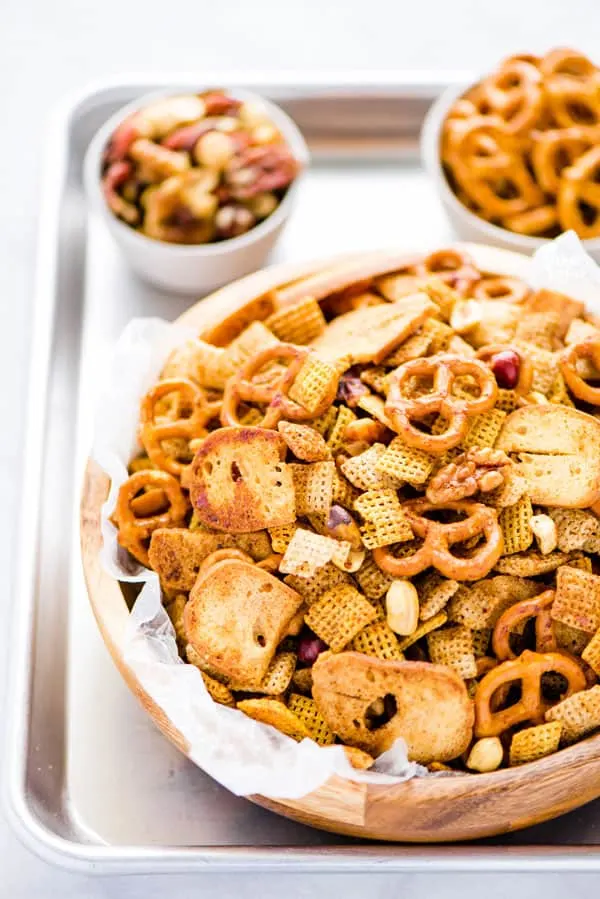 Your favorite Chex Mix recipe gets a sweet and spicy update that’s crazy addicting! It’s the perfect party snack and super easy to make. If you love classic Chex Snack Mix, you’ll love this version. It’s slightly sweet, slightly savory, and you can control how spicy you want it by increasing or decreasing the amount of cayenne pepper to your liking. This is a staple snack for holiday parties, bbq’s, and game day. Recipe is made gluten free but can be made with regular pretzels and bagel chips.