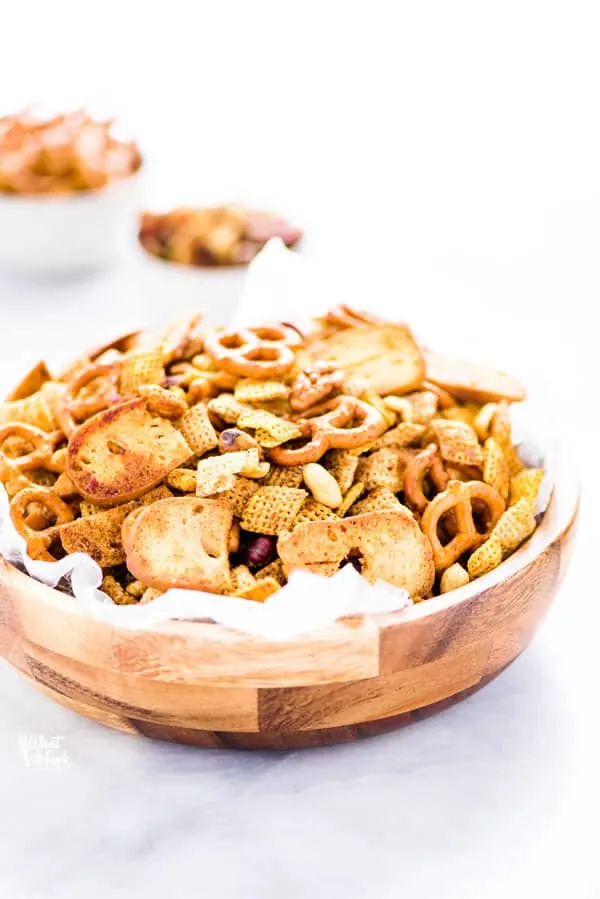 Sweet and Spicy Homemade Chex Mix in a wood bowl lined with wax paper