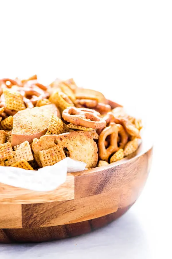 Your favorite Chex Mix recipe gets a sweet and spicy update that’s crazy addicting! It’s the perfect party snack and super easy to make. If you love classic Chex Snack Mix, you’ll love this version. It’s slightly sweet, slightly savory, and you can control how spicy you want it by increasing or decreasing the amount of cayenne pepper to your liking. This is a staple snack for holiday parties, bbq’s, and game day. Recipe is made gluten free but can be made with regular pretzels and bagel chips.