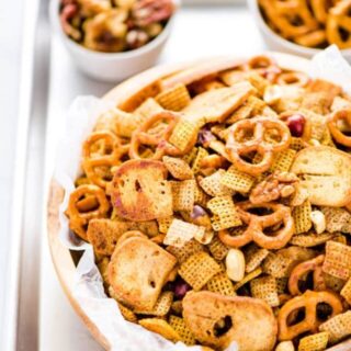 Your favorite Chex Mix recipe gets a sweet and spicy update that’s crazy addicting! It’s the perfect party snack and super easy to make. If you love classic Chex Snack Mix, you’ll love this version. It’s slightly sweet, slightly savory, and you can control how spicy you want it by increasing or decreasing the amount of cayenne pepper to your liking. This is a staple snack for holiday parties, bbq’s, and game day. Recipe is made gluten free but can be made with regular pretzels and bagel chips.