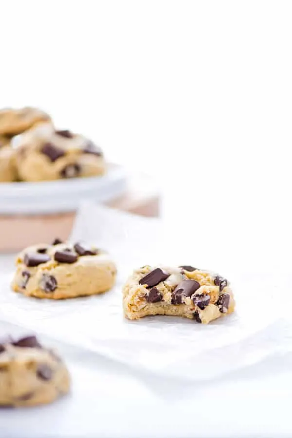 A gluten free sourdough chocolate chip cookie with a bite taken out