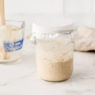 Learn how to make a sourdough starter with gluten free flour with 2 ingredients and minimal equipment. Follow the detailed feeding schedule (free printable schedule available). Learn the basic tools you need, gluten free flour recommendations, and all your sourdough starter questions are answered. This how-to post is full of information to set you up for sourdough starter success. Recipe and tutorial from @whattheforkblog - visit whattheforkfoodblog.com for more gluten free baking recipes.