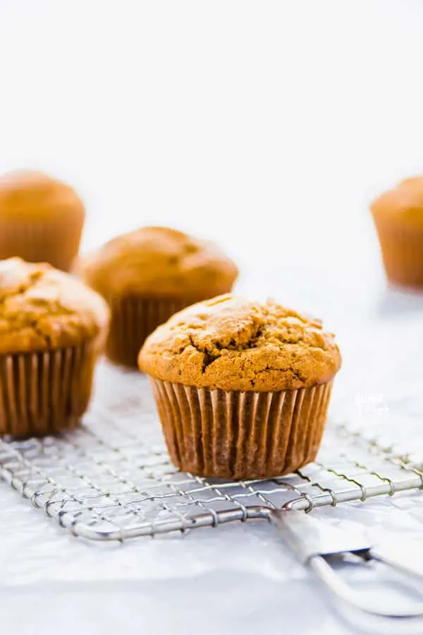 Gluten Free Sweet Potato Muffins cooling on a small, rectangular wire rack