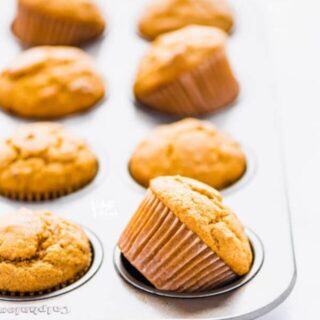 Gluten Free Sweet Potato Muffins in a silver muffin tin cooling after coming out of the oven