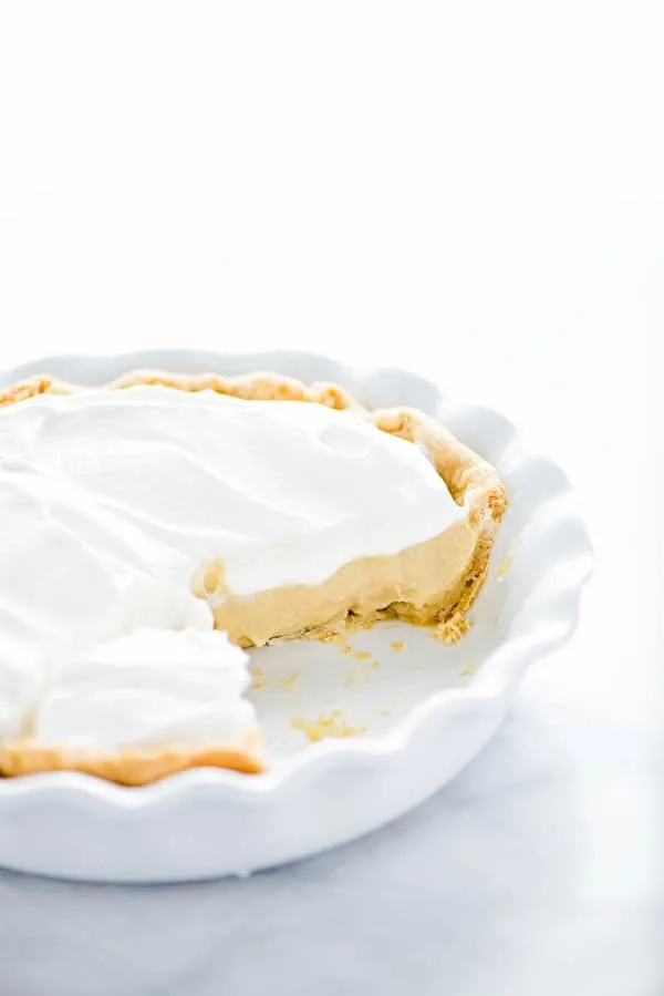 Maple Cream Pie in a white pie dish that's been cut into
