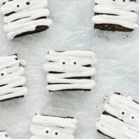 Gluten Free Mummy Brownies decorated for Halloween on crinkled wax paper