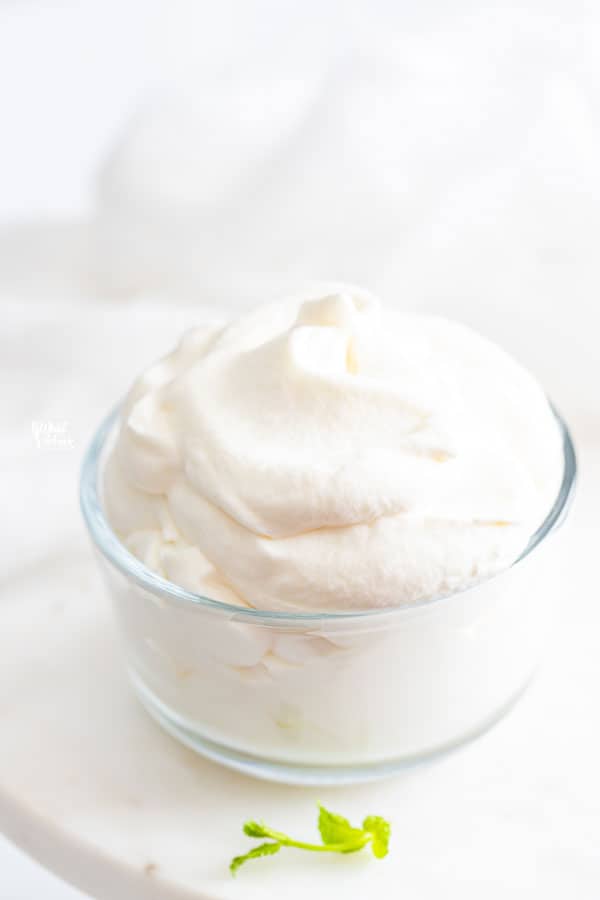 homemade whipped cream recipe in a glass dish ready to be served