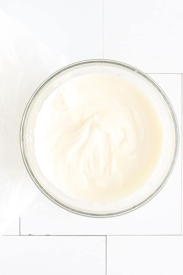 overhead shot of Homemade Whipped Cream in a glass bowl