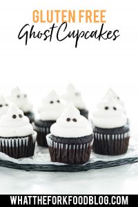 Gluten Free Halloween Ghost Cupcakes on a black wire rack lined with wax paper - image with text for Pinterest