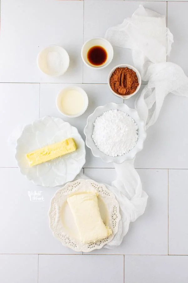 ingredients for chocolate cream cheese frosting in individual bowls and plates