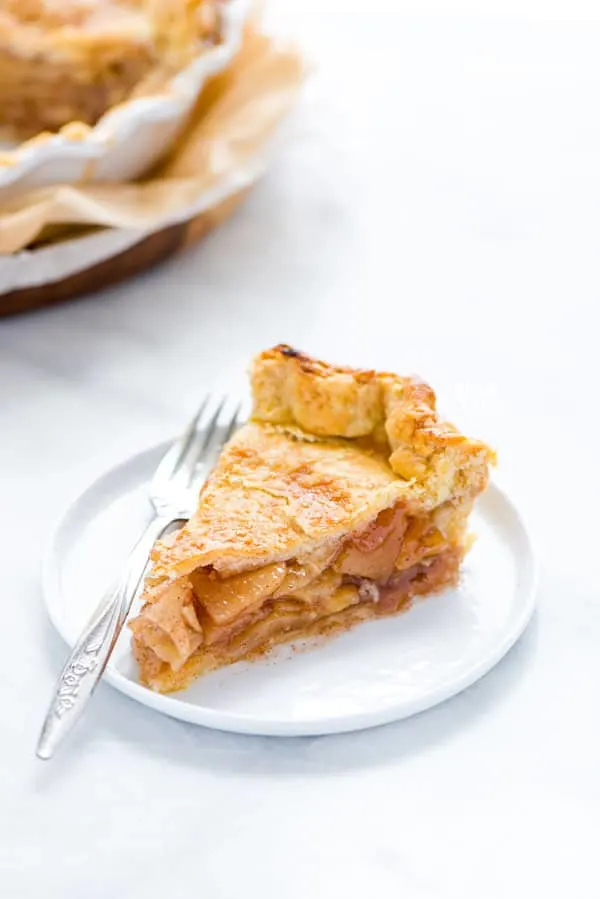 a slice of easy apple pie (gluten free) on a small white plate