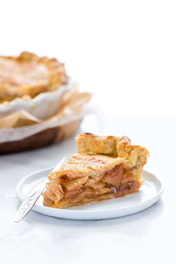 a slice of gluten free apple pie on a small white plate