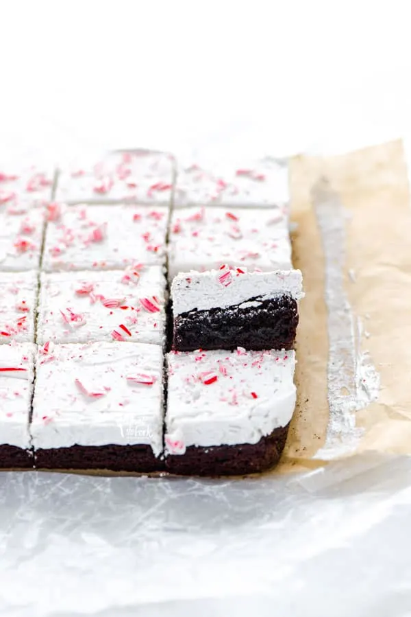 sliced gluten free peppermint brownies on unbleached parchment paper