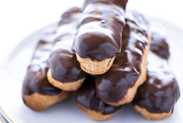 baked and stacked gluten free chocolate eclair recipe ready to serve on a white plate