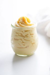 Homemade pastry cream piped into a small Weck tulip jar
