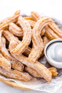 Gluten Free Churros Recipe on a wood platter ready to be served