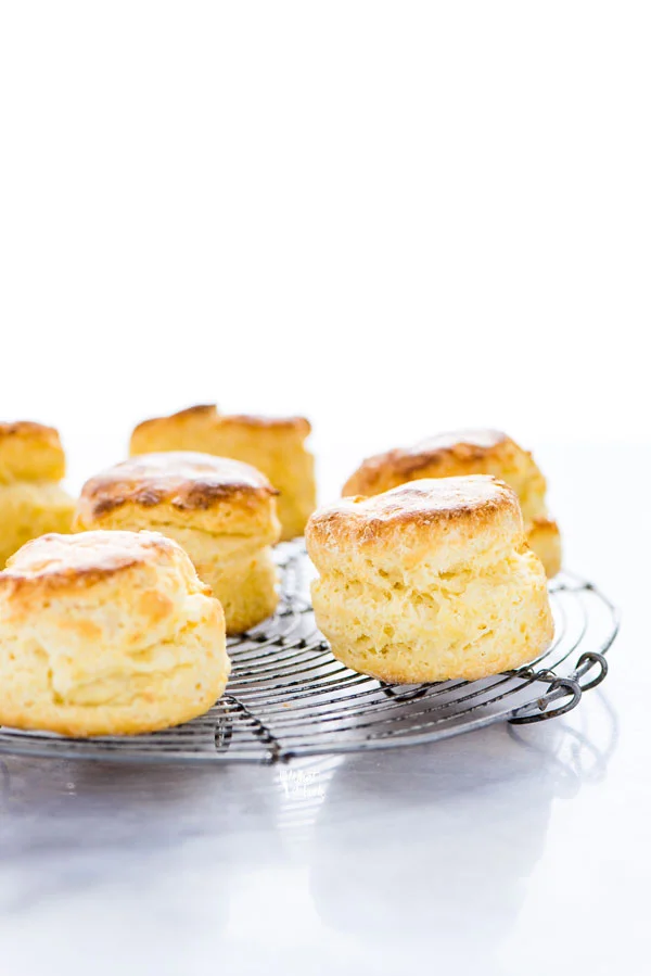 baked homemade gluten free scones on a round wire cooling rack
