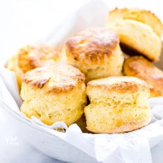 gluten free scones in a white bowl lined with a white napkin