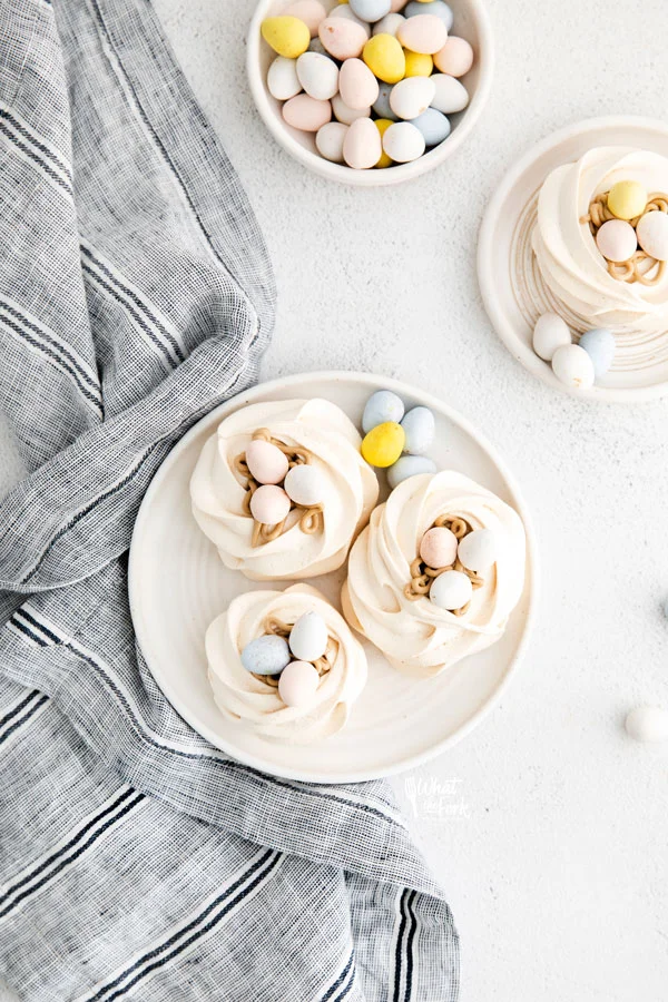 overhead shot of Easter Meringue Nests on a white plate