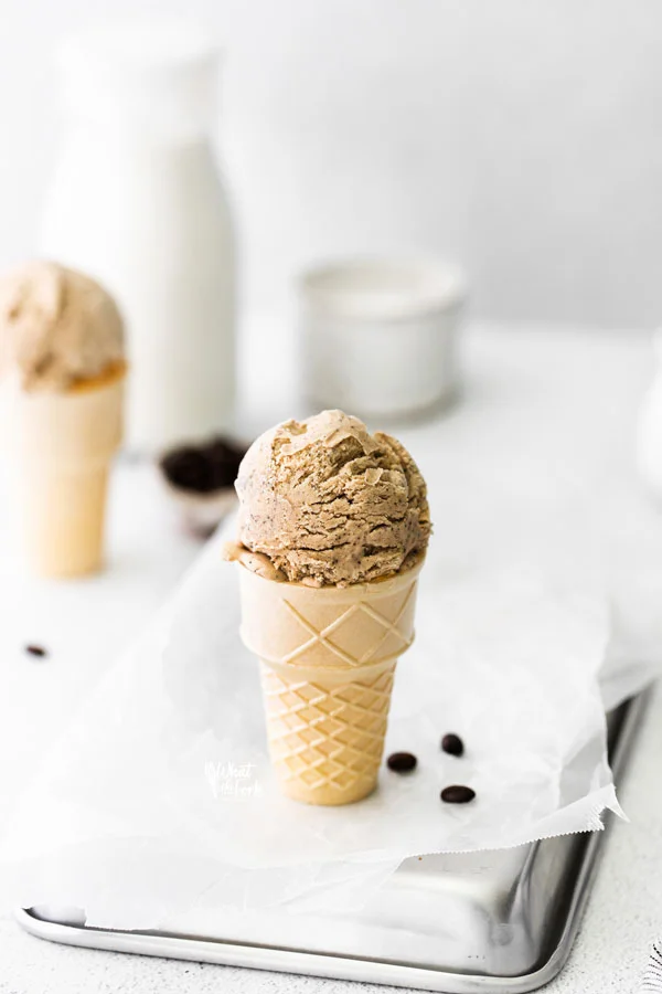 a scoop of No Churn Coffee Ice Cream in an ice cream cone